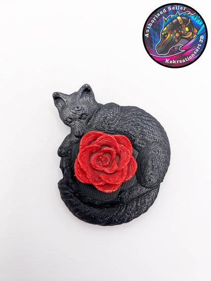a extremely detailed 3D printed black fox curled up around a bright red rose. The rose spins, making it a wonderful fidget toy